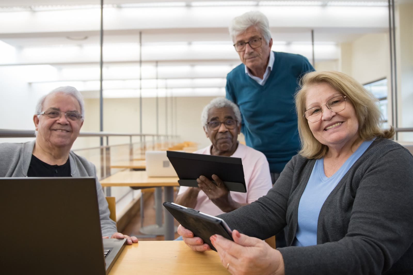 Adults practicing together with a tablet.